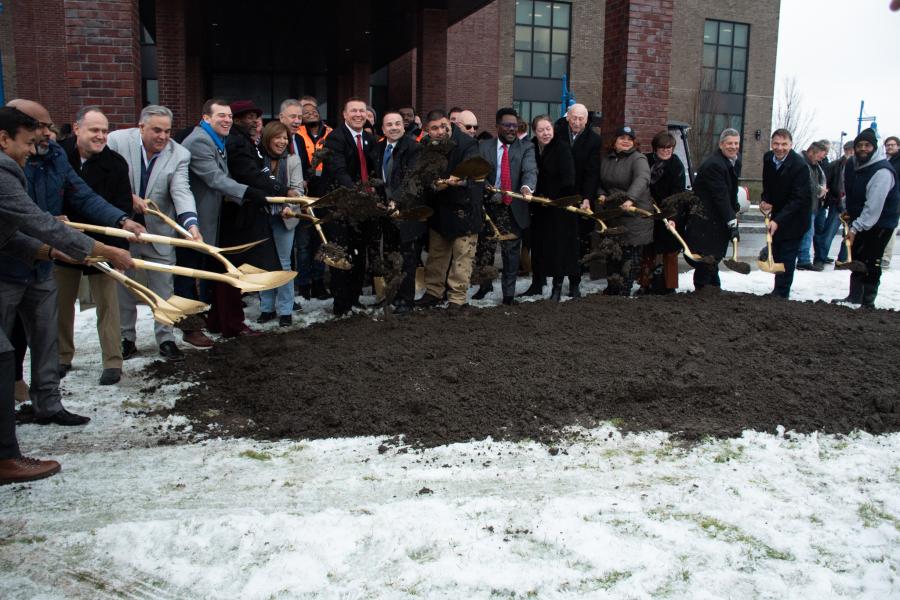 Photo of Mayor Ganim, Bridgeport delegates, Governor Ned Lamont, and others breaking ground for The August housing units at Steelpointe Harbor in Bridgeport