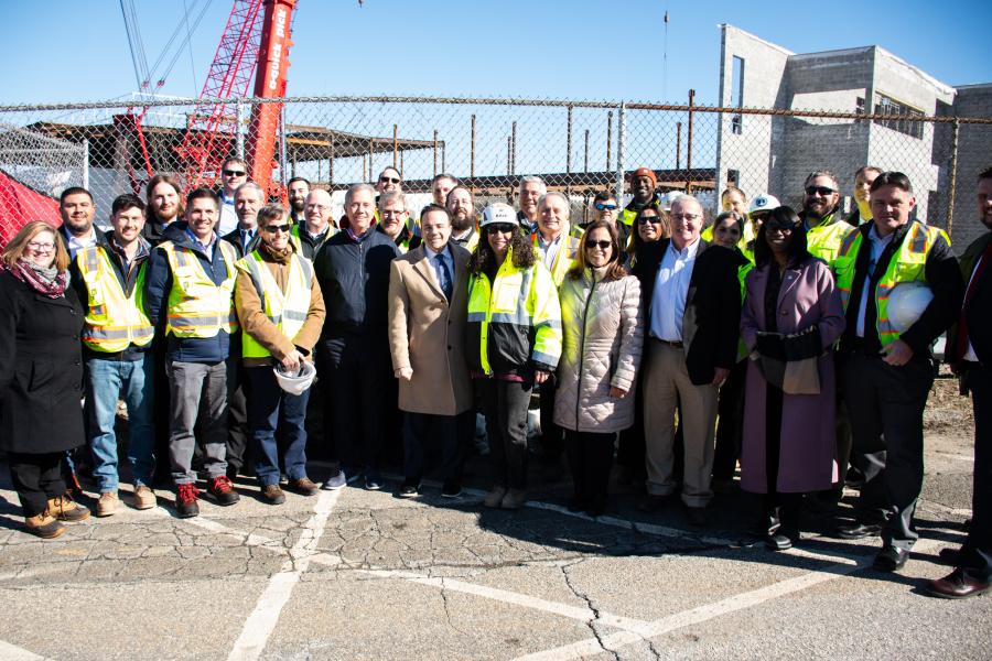 Photo of construction workers, CT State Delegates, Mayor Ganim, and Bullard-Havens High School students at the beam signing ceremony