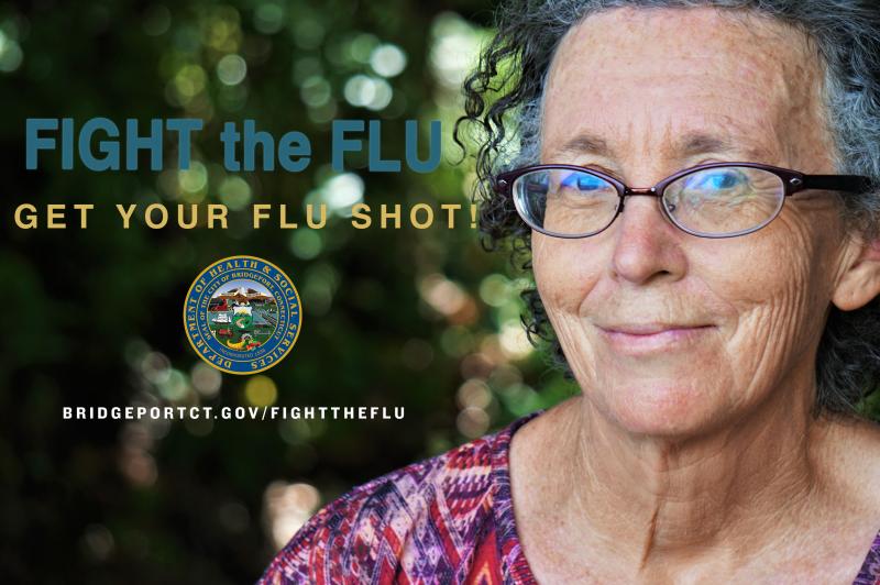 Close up of an elder woman and the words "Fight the Flu, Get your flu shot!"
